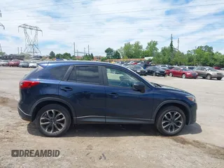 2016 Mazda CX-5 Grand Touring z VIN JM3KE4DY1G0817562, wystawiony jako IAAI lot #42289929 z przebiegiem 135 476 mil mil oraz . Historia ofert i sprzedaży dostępna na DreamBid. Obrazek 13.