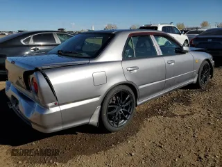 1999 Nissan Skyline z VIN HR34005885, wystawiony jako Copart lot #75422984 z przebiegiem 150 776 mil mil oraz Szkoda całkowita • Salvage title. Historia ofert i sprzedaży dostępna na DreamBid. Obrazek 3.