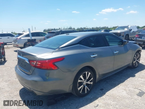 2016 Nissan Maxima SL with VIN 1N4AA6AP9GC901494, listed as a IAAI auction lot 42023106 with 160,581 mi miles and . Bid and sale history available at DreamBid. Image 4.
