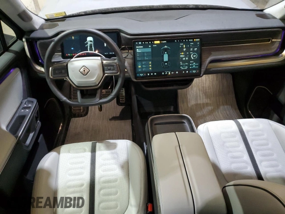 2024 Rivian R1T Adventure z VIN 7FCTGCAA0RN030370, wystawiony jako Copart lot #87251784 z przebiegiem 11 549 mil mil oraz Szkody całkowita. Historia ofert i sprzedaży dostępna na DreamBid. Obrazek 8.