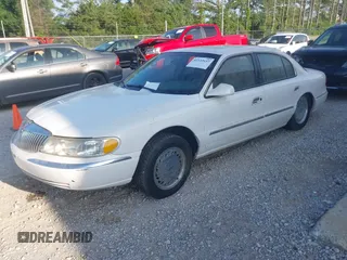 1998 Lincoln Continental z VIN 1LNLM97V1WY602564, wystawiony jako IAAI lot #42333637 z przebiegiem 142 234 mil mil oraz . Historia ofert i sprzedaży dostępna na DreamBid. Obrazek 2.