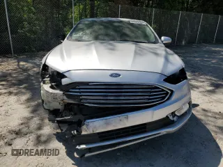 2018 Ford Fusion SE z VIN 3FA6P0HD3JR238137, wystawiony jako Copart lot #54828205 z przebiegiem 131 221 mil mil oraz Szkoda całkowita • Salvage title. Historia ofert i sprzedaży dostępna na DreamBid. Obrazek 5.