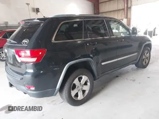 2012 Jeep Grand Cherokee Laredo with VIN 1C4RJFAT8CC182128, listed as a IAAI auction lot 40154044 with 239,601 mi miles. Bid and sale history available at carsss.com. Image 4.