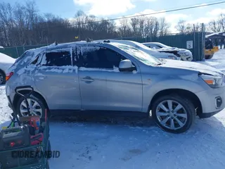 2015 Mitsubishi Outlander ES z VIN 4A4AP3AU0FE040621, wystawiony jako IAAI lot #41364883 z przebiegiem 187 454 mil mil oraz . Historia ofert i sprzedaży dostępna na DreamBid. Obrazek 13.