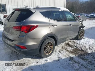 2017 Hyundai Santa Fe 2.4L with VIN 5NMZUDLB4HH034437, listed as a IAAI auction lot 41565545 with 96,640 mi miles and . Bid and sale history available at DreamBid. Image 4.