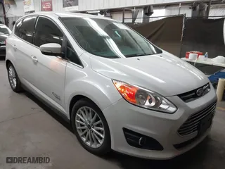 2014 Ford C-Max Energi SEL with VIN 1FADP5CU9EL517057, listed as a IAAI auction lot 41679764 with 125,040 mi miles. Bid and sale history available at carsss.com. Image 1.
