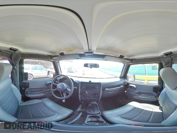 2009 Jeep Wrangler X z VIN 1J4FA24179L716499, wystawiony jako Copart lot #58342675 z przebiegiem 116 871 mil mil oraz Szkoda całkowita • Salvage title. Historia ofert i sprzedaży dostępna na DreamBid. Obrazek 13.