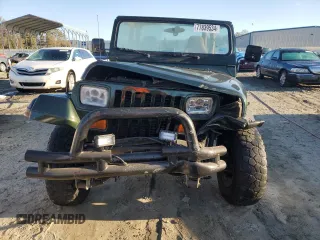1995 Jeep Wrangler Sahara with VIN 1J4FY49S6SP272569, listed as a Copart auction lot 77839534 with 162,080 mi miles and Salvage Title. Bid and sale history available at carsss.com. Image 5.