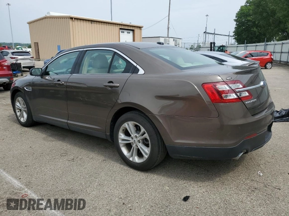 2015 Ford Taurus SEL with VIN 1FAHP2E89FG193926, listed as a Copart auction lot 61036375 with 23,963 mi miles and Salvage title. Bid and sale history available at DreamBid. Image 2.
