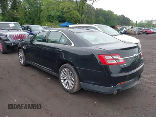 2014 Ford Taurus Limited z VIN 1FAHP2J8XEG112310, wystawiony jako IAAI lot #42367397 z przebiegiem 77 329 mil mil oraz . Historia ofert i sprzedaży dostępna na DreamBid. Obrazek 3.