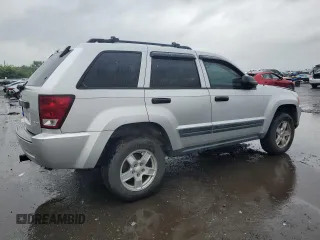 2005 Jeep Grand Cherokee Laredo with VIN 1J4GR48K55C719634, listed as a Copart auction lot 61809195 with 141,316 mi miles and Salvage title. Bid and sale history available at DreamBid. Image 3.