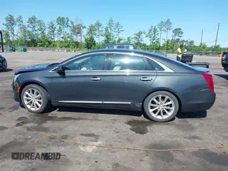 2014 Cadillac XTS Luxury z VIN 2G61M5S37E9211547, wystawiony jako IAAI lot #42373128 z przebiegiem 146 354 mil mil oraz . Historia ofert i sprzedaży dostępna na DreamBid. Obrazek 14.