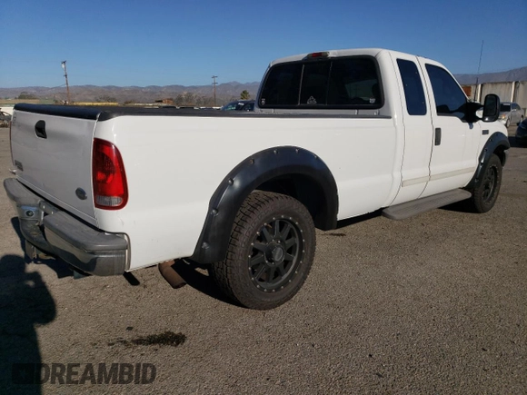 2002 Ford F-250 XL with VIN 1FTNX20L32ED10043, listed as a Copart auction lot 82608574 with 150,324 mi miles and Salvage title. Bid and sale history available at DreamBid. Image 3.
