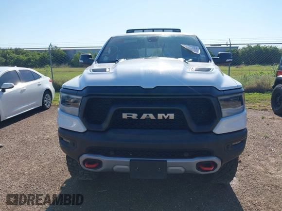 2019 Ram 1500 Rebel z VIN 1C6SRFLT5KN923837, wystawiony jako IAAI lot #41961921 z przebiegiem 68 400 mil mil oraz . Historia ofert i sprzedaży dostępna na DreamBid. Obrazek 6.