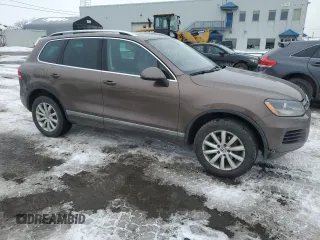 2012 Volkswagen Touareg Sport z VIN WVGEF9BP8CD006057, wystawiony jako Copart lot #47739265 z przebiegiem 213 580 mil mil oraz Szkoda całkowita • Salvage title. Historia ofert i sprzedaży dostępna na DreamBid. Obrazek 4.