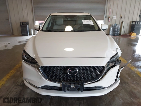 2021 Mazda 6 Carbon Edition with VIN JM1GL1WY9M1614117, listed as a IAAI auction lot 41305576 with 54,670 mi miles and . Bid and sale history available at DreamBid. Image 12.