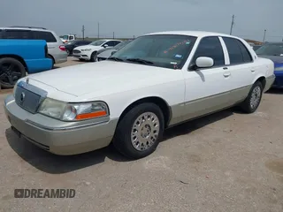 2004 Mercury Grand Marquis GS z VIN 2MEFM74W54X654116, wystawiony jako IAAI lot #41875021 z przebiegiem 129 999 mil mil oraz . Historia ofert i sprzedaży dostępna na DreamBid. Obrazek 2.
