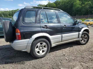 1999 Suzuki Grand Vitara z VIN JS3TD62VXX4100236, wystawiony jako Copart lot #57228075 z przebiegiem Nie podano mil oraz Szkody całkowita. Historia ofert i sprzedaży dostępna na DreamBid. Obrazek 3.