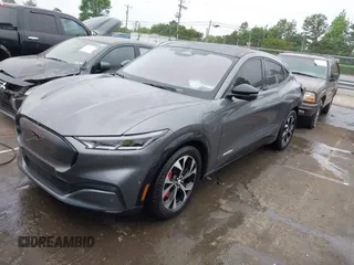 2021 Ford Mustang Mach-E Premium z VIN 3FMTK3R74MMA27709, wystawiony jako IAAI lot #42102335 z przebiegiem 54 988 mil mil oraz . Historia ofert i sprzedaży dostępna na DreamBid. Obrazek 2.
