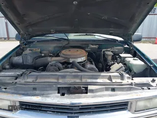 1995 Chevrolet Suburban with VIN 1GNGK26N9SJ397588, listed as a IAAI auction lot 42114009 with 238,914 mi miles. Bid and sale history available at carsss.com. Image 10.