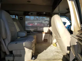 2000 Ford Econoline Cargo with VIN 1FDRE14W9YHA92344, listed as a Copart auction lot 83749374 with 164,823 mi miles and Salvage Title. Bid and sale history available at DreamBid. Image 11.