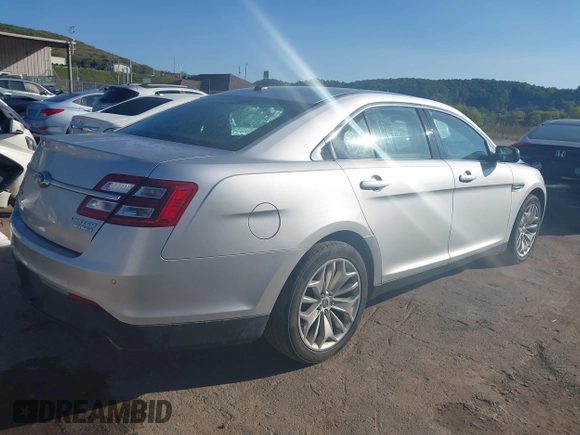 2014 Ford Taurus Limited with VIN 1FAHP2F8XEG133523, listed as a IAAI auction lot 40285220 with 134,939 mi miles. Bid and sale history available at carsss.com. Image 4.