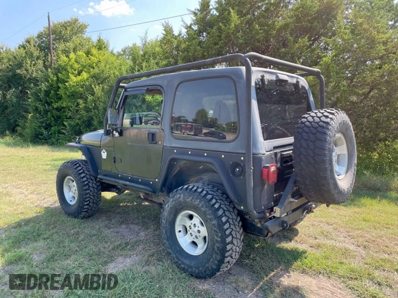 1999 Jeep Wrangler Sahara with VIN 1J4FY49S5XP496486, listed as a Copart auction lot 54989365 with 128,498 mi miles and Clean Title. Bid and sale history available at carsss.com. Image 3.