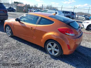 2015 Hyundai Veloster with VIN KMHTC6AD2FU225073, listed as a IAAI auction lot 41571336 with 128,819 mi miles. Bid and sale history available at carsss.com. Image 3.