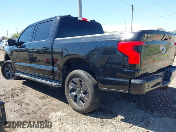2023 Ford F-150 Lightning Pro with VIN 1FTVW1EV0PWG52297, listed as a IAAI auction lot 41730201 with 11,303 mi miles. Bid and sale history available at carsss.com. Image 3.