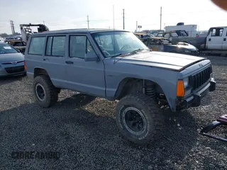 1989 Jeep Cherokee z VIN 1J4FJ28L2KL478546, wystawiony jako IAAI lot #41493867 z przebiegiem 226 535 mil mil oraz . Historia ofert i sprzedaży dostępna na DreamBid. Obrazek 1.