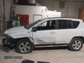 2012 Jeep Compass Latitude with VIN 1C4NJDEB0CD676725, listed as a IAAI auction lot 41948874 with 143,833 mi miles. Bid and sale history available at carsss.com. Image 14.