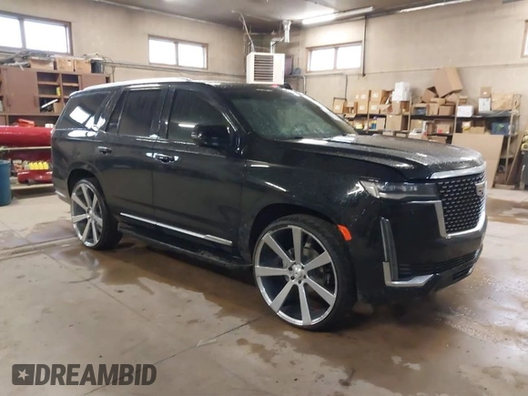 2021 Cadillac Escalade Luxury z VIN 1GYS4AKL7MR295510, wystawiony jako IAAI lot #38398966 z przebiegiem 26 228 mil mil oraz . Historia ofert i sprzedaży dostępna na DreamBid. Obrazek 1.