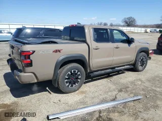 2024 Nissan Frontier PRO-4X with VIN 1N6ED1EK7RN610467, listed as a Copart auction lot 50138015 with 24,723 mi miles and Salvage Title. Bid and sale history available at carsss.com. Image 3.