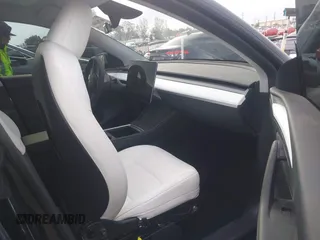 2024 Tesla Model Y with VIN 7SAYGDED8RF116209, listed as a IAAI auction lot 41761804 with 12,048 mi miles and . Bid and sale history available at DreamBid. Image 5.