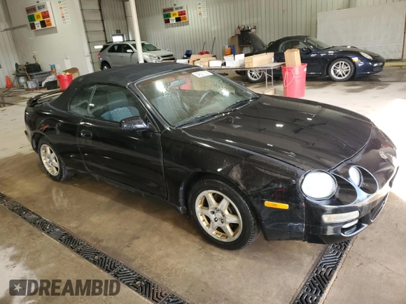 1997 Toyota Celica GT z VIN JT5FG02T3V0041206, wystawiony jako Copart lot #54601725 z przebiegiem 198 685 mil mil oraz Szkody całkowita. Historia ofert i sprzedaży dostępna na DreamBid. Obrazek 4.