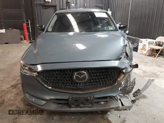 2021 Mazda CX-5 Touring with VIN JM3KFBCM5M0365725, listed as a IAAI auction lot 41411763 with 77,504 mi miles. Bid and sale history available at carsss.com. Image 13.