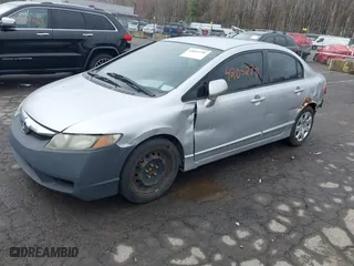2009 Honda Civic Sdn LX with VIN 2HGFA16559H313538, listed as a IAAI auction lot 42052791 with 136,594 mi miles. Bid and sale history available at carsss.com. Image 2.