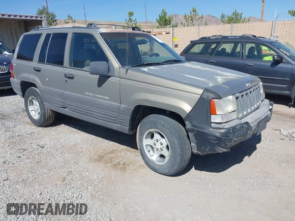 1997 Jeep Grand Cherokee Laredo with VIN 1J4GZ58S3VC603239, listed as a IAAI auction lot 42593915 with 295,696 mi miles and . Bid and sale history available at DreamBid. Image 1.