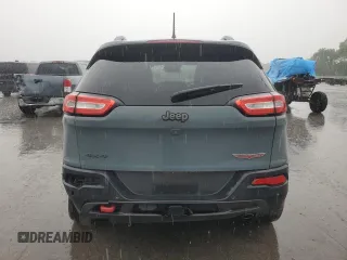 2014 Jeep Cherokee Trailhawk z VIN 1C4PJMBS7EW236960, wystawiony jako Copart lot #57098695 z przebiegiem 159 065 mil mil oraz Czysty tytuł • Clean title. Historia ofert i sprzedaży dostępna na DreamBid. Obrazek 6.
