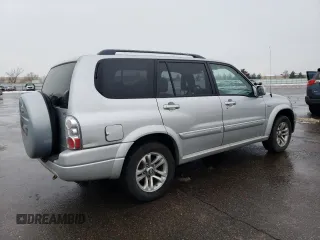 2005 Suzuki XL7 LX z VIN JS3TX92V054108383, wystawiony jako Copart lot #85280414 z przebiegiem 128 594 mil mil oraz Szkoda całkowita • Salvage title. Historia ofert i sprzedaży dostępna na DreamBid. Obrazek 3.