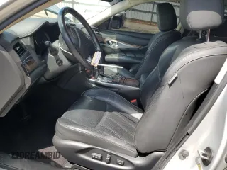 2012 Infiniti M Hybrid with VIN JN1EY1AP0CM910697, listed as a Copart auction lot 60821335 with 145,533 mi miles and Salvage title. Bid and sale history available at DreamBid. Image 7.