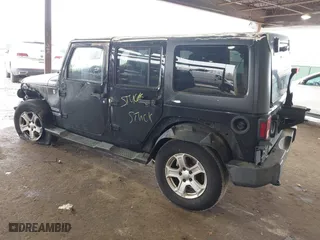 2015 Jeep Wrangler Unlimited Willys Wheeler with VIN 1C4BJWDG9FL652607, listed as a IAAI auction lot 41836193 with 166,152 mi miles. Bid and sale history available at carsss.com. Image 3.