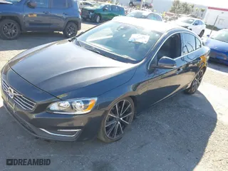 2016 Volvo S60 T5 Drive-E Premier with VIN YV126MFK2G2396190, listed as a IAAI auction lot 41682077 with 114,057 mi miles. Bid and sale history available at carsss.com. Image 2.