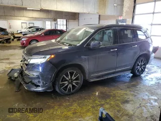 2020 Honda Pilot Touring 7-Passenger z VIN 5FNYF6H67LB031880, wystawiony jako Copart lot #46083925 z przebiegiem 59 729 mil mil oraz Szkoda całkowita • Salvage title. Historia ofert i sprzedaży dostępna na DreamBid. Obrazek 1.