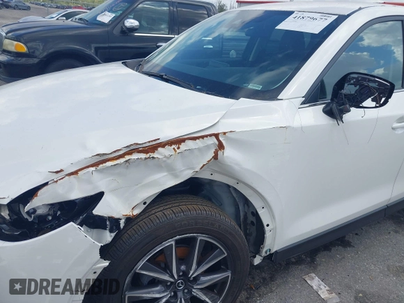 2018 Mazda CX-5 Touring z VIN JM3KFACM6J1419663, wystawiony jako IAAI lot #41879677 z przebiegiem 115 224 mil mil oraz . Historia ofert i sprzedaży dostępna na DreamBid. Obrazek 20.