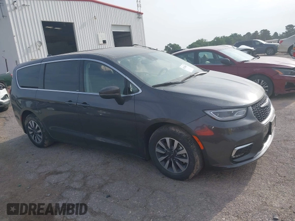2023 Chrysler Pacifica Hybrid Touring L z VIN 2C4RC1L73PR598923, wystawiony jako IAAI lot #42124867 z przebiegiem 51 173 mil mil oraz . Historia ofert i sprzedaży dostępna na DreamBid. Obrazek 13.