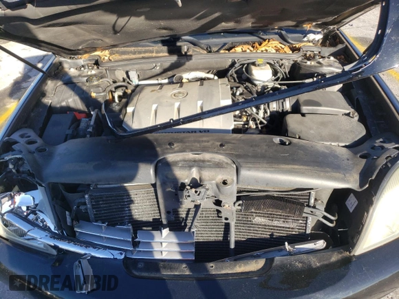 2004 Cadillac DTS Professional 1SH z VIN 1GEEH00Y34U500616, wystawiony jako Copart lot #79513664 z przebiegiem 92 769 mil mil oraz Szkody całkowita. Historia ofert i sprzedaży dostępna na DreamBid. Obrazek 12.