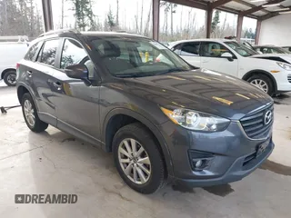 2016 Mazda CX-5 Touring with VIN JM3KE4CY4G0779827, listed as a IAAI auction lot 41840727 with 91,367 mi miles. Bid and sale history available at carsss.com. Image 1.