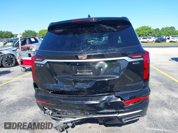 2020 Cadillac XT6 FWD Premium Luxury with VIN 1GYKPCRS7LZ211197, listed as a IAAI auction lot 42231424 with 57,351 mi miles and . Bid and sale history available at DreamBid. Image 17.
