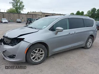 2020 Chrysler Pacifica Touring L with VIN 2C4RC1BG2LR127986, listed as a IAAI auction lot 42419518 with 107,618 mi miles and . Bid and sale history available at DreamBid. Image 2.